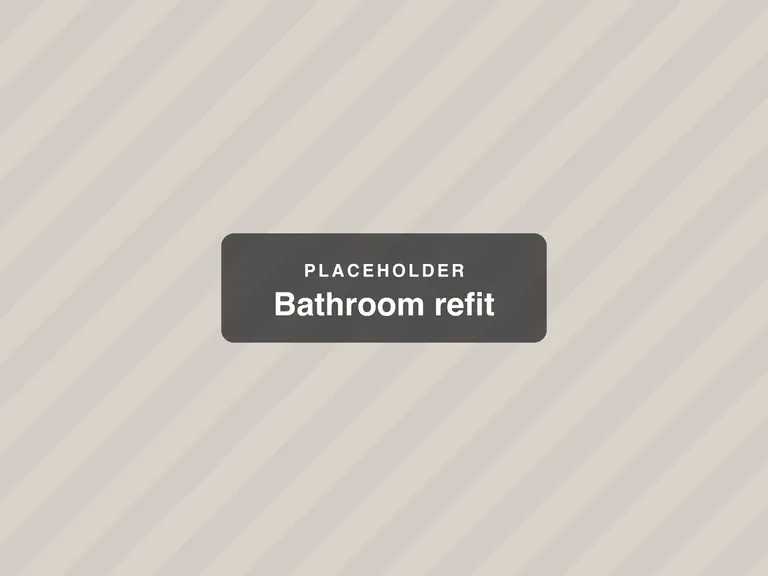 The finished bathroom with a walk-in shower